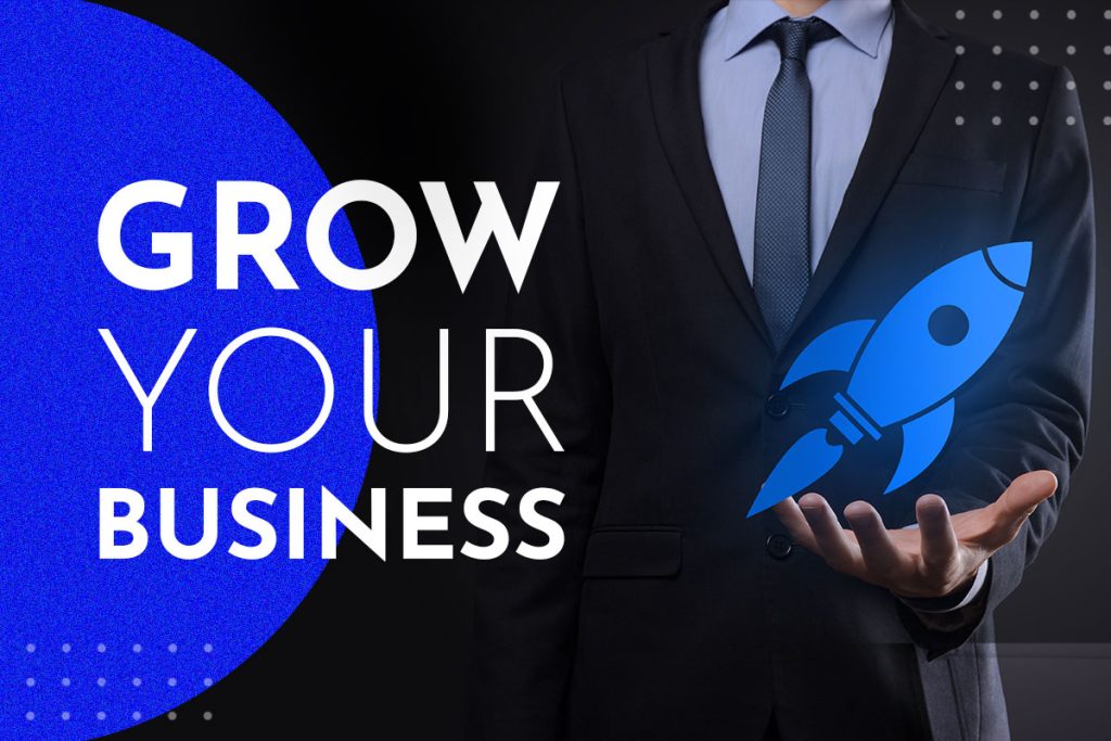 Business growth concept with a man in a suit holding a holographic rocket.