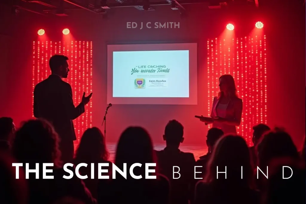 The Science Behind: A presentation on life coaching with a speaker and audience in a red-lit seminar room.