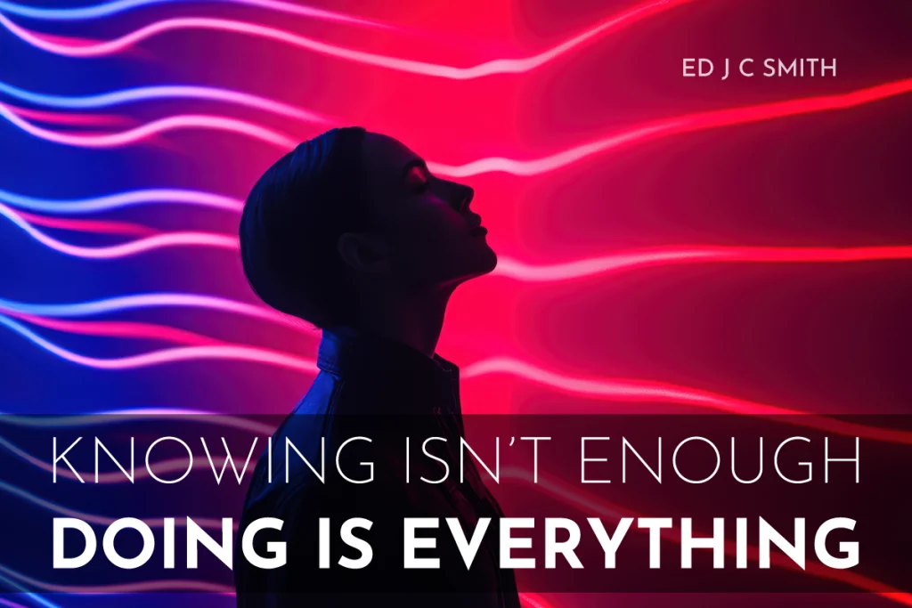 Silhouette of a person standing against a vibrant red and blue neon background with the motivational quote "Knowing isn’t enough, doing is everything" by Ed J C Smith — inspiring message for coaching clients.