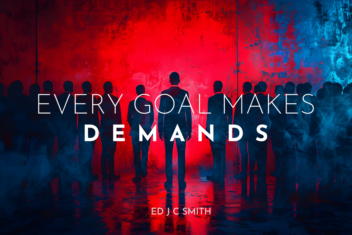 Silhouetted figure facing a crowd with bold red and blue lighting, captioned “Every Goal Makes Demands” — symbolizing the pressure behind ambition.